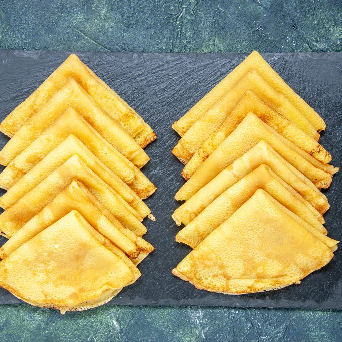 top view delicious pancakes on dark-blue background color pastry bake oven pie cake dough breakfast meat